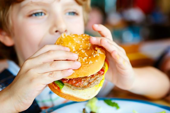 kid eating burger